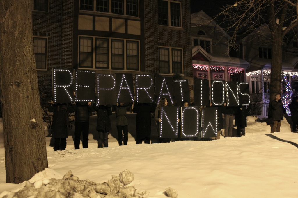 After holding up their message directly in front of Rahm Emanuel's home, activists crossed the street to make sure the mayor could clearly read the light banner from his window. Lights went on at the front of the house during the protest. Rahm Emanuel was reportedly home at the time. (Photo: Kelly Hayes)
